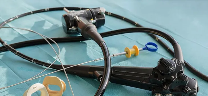 Endoscope maintenance and repair bench with rigid scopes laid out for inspection